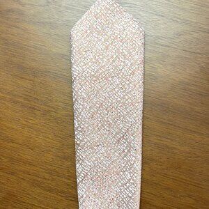 Val and Maxx silk Italian salmon colored tie with a subtle diagonal pattern